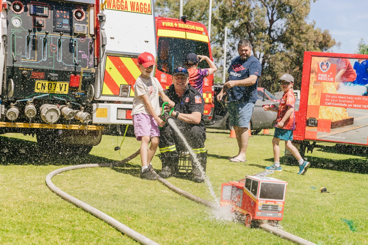 Fireman assisting a kid